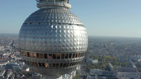 AERIAL: Super Close Up View Circle Around the Alexanderplatz TV Tower in Berlin, Germany