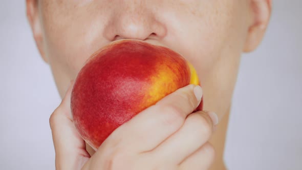 Lower Face Caucasian Female Eats Red Peach Portrait Lady