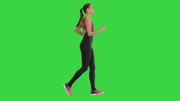 Confident Beautiful Fit Girl Jogging on a Green Screen Chroma Key