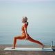 Morning Exercises Yoga a Woman Alone on the Seashore - VideoHive Item for Sale