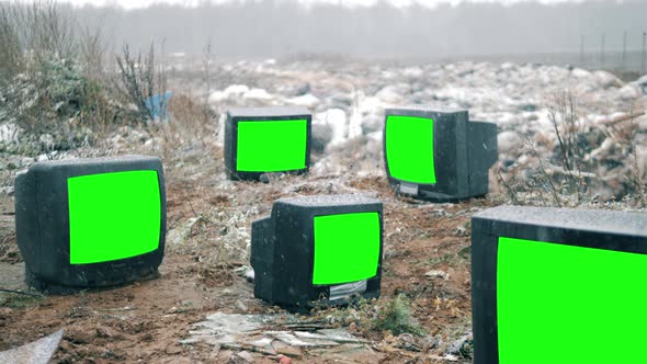 Dumping Site and Thrown-out TVs with Green Screens