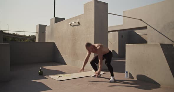 Sportsman Doing Burpee Exercise on Street