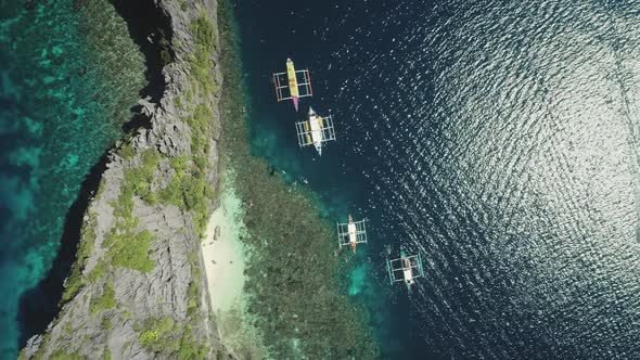 Top Down Aerial View of Passenger Boats at Shallow Ocean Coast Water alt