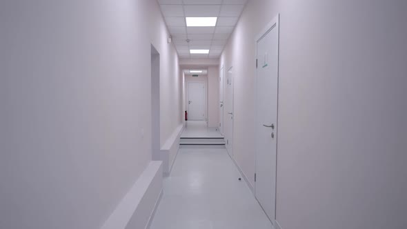 Panning Shot of White Medical Clinic Hallway with No People