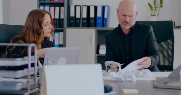 Tensed Overworked Businessman Working in Office on a Project