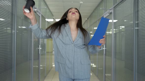 Delighted Company Director in Grey Jacket Walks Along Hall