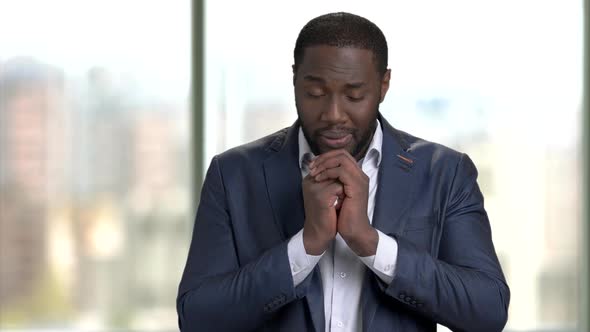 Portrait of Black African Business Man Praying To God