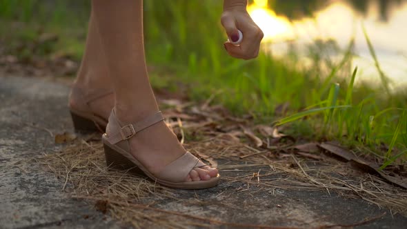 Closeup Shot of a Beautiful Young Woman Applying an Antimosquito Repellent Spray on Her Skin