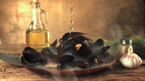 Super Slow Motion on the Hot Mussels on the Plate Drops Water