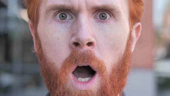 Close up of Shocked Face of Beard Young Man Face