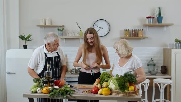 Girl Measuring with Tape Measure Her Slim Waist and Braging in Front of Grandparents. Raw Food Diet