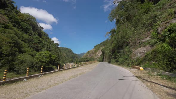 Aerial View of Man Driving Motorbike in Palm Trees Road in the Philippines