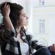 Young Woman Sitting on Window Sill and Enjoying Old Town View - VideoHive Item for Sale