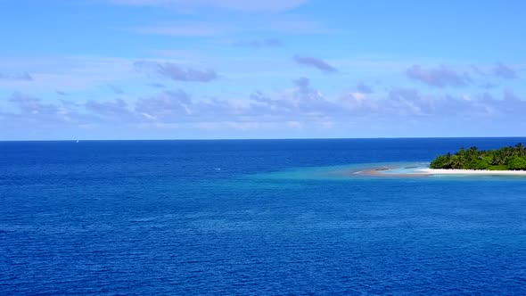 Aerial landscape of shore beach time by blue ocean with sand background