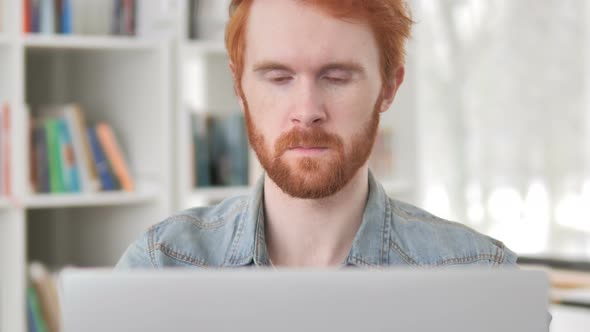 Smiling Casual Redhead Man Looking at Camera