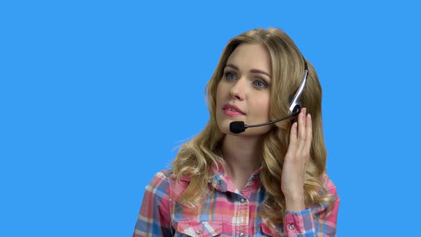 Beautiful Consultant of Call Center on Color Background