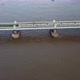 A Drone View of the Fulham Railway Bridge Up Close with a Train Driving Over It - VideoHive Item for Sale