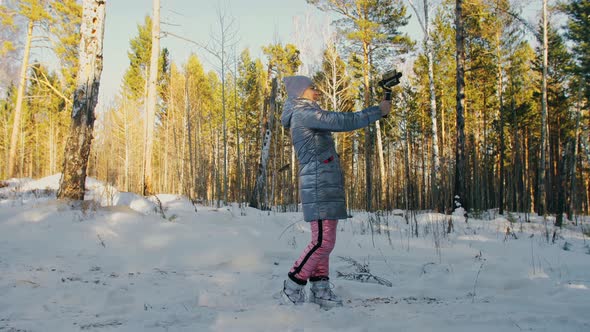 Woman Holding On Handheld Film 3Axis Gimbal Stabilization Device in Winter for Smartphone