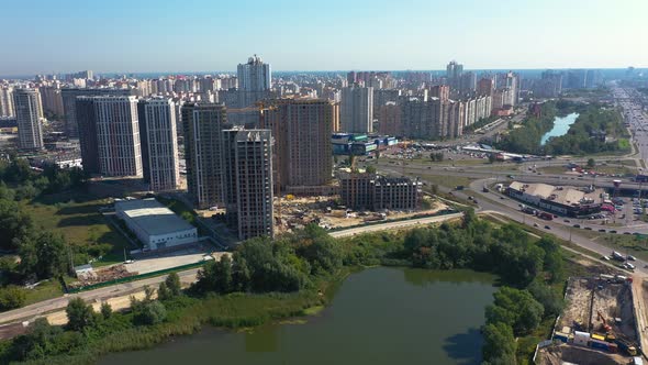 Landscape in the City with Under Construction Buildings and Industrial Cranes