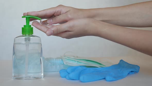 Close Up Of A Woman Hand Squeezing Out A Disinfectant Gel From Against Virus