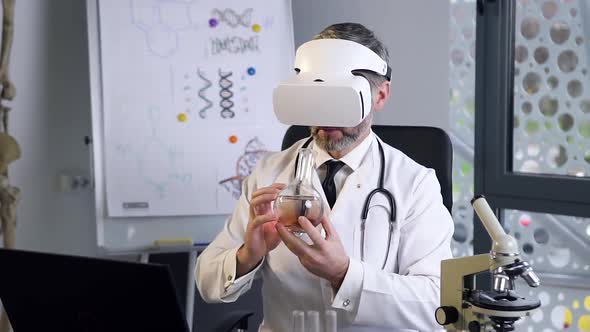 Male Middle Age Scientist in Virtual Reality Glasses, Uses Test Tube