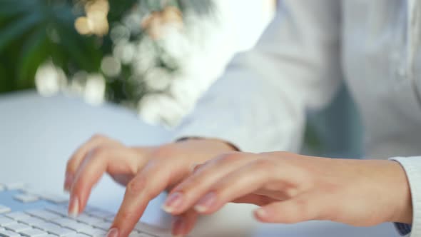 Female Hands Busy Working on Computer Keyboard for Sending Emails and Surf on a Web Browser