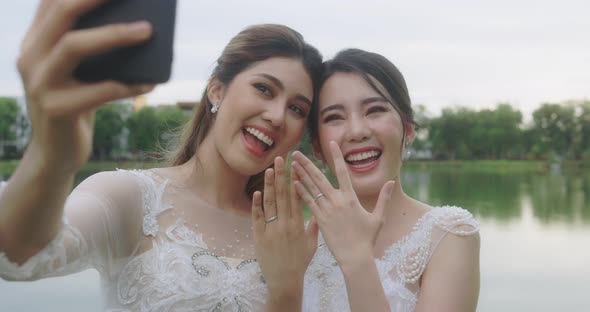 The Married LGBT Couple Happily Chatting Over Video Calls With Friends.