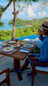 Breakfast on the Beach in Thailand a Luxury Breakfast Table with Food and Beautiful Tropical Sea