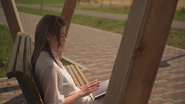 Girl Flipping Through a Book