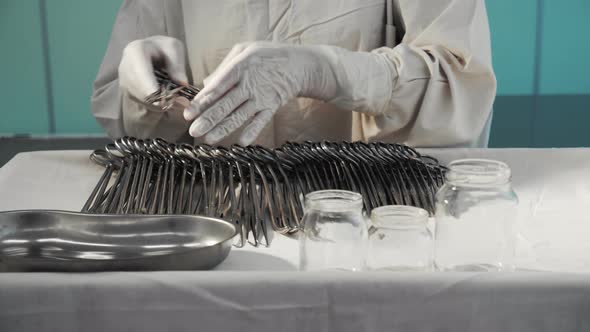 Nurse Preparing Sterile Surgical Instruments Healthcare Worker Prepares Tools