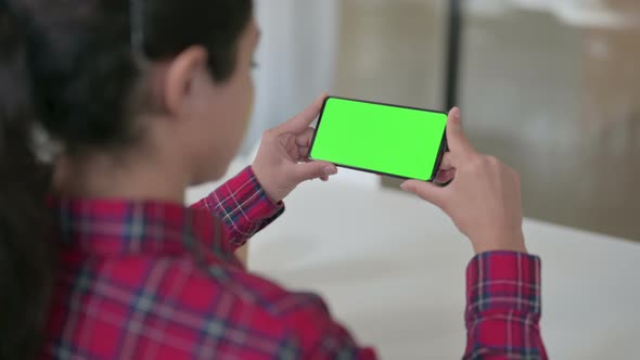Indian Woman Watching Smartphone with Green Screen