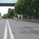 Five Young People Run Along the City s Embankment on a Summer Day and Greet the Spectators - VideoHive Item for Sale