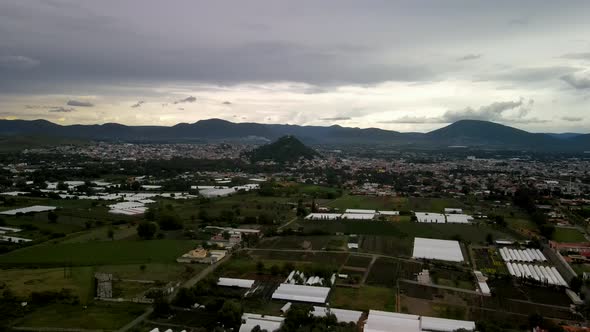 View of a storm above church in central mexico valley