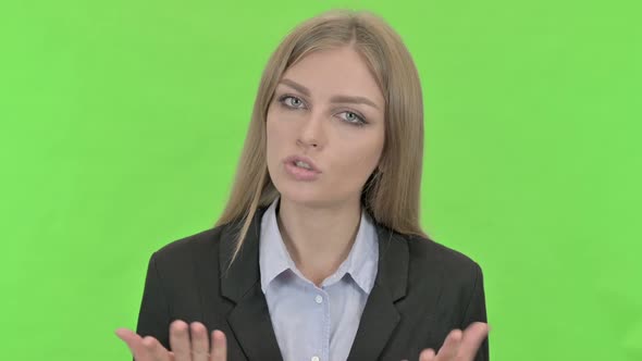 Professional Businesswoman Having Conversation Against Chroma Key