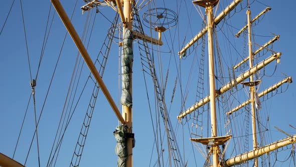 Tilting shot of three masts of tall ship boat hotel Alexander Von Humboldt in Bremen. No sails and c