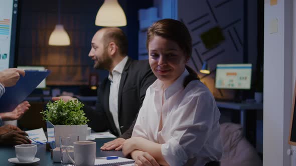 Portrait of Workaholic Businesswoman Looking Into Camera While Working in Company Office Meeting