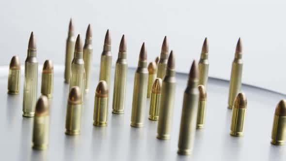 Cinematic rotating shot of bullets on a metallic surface - BULLETS 076
