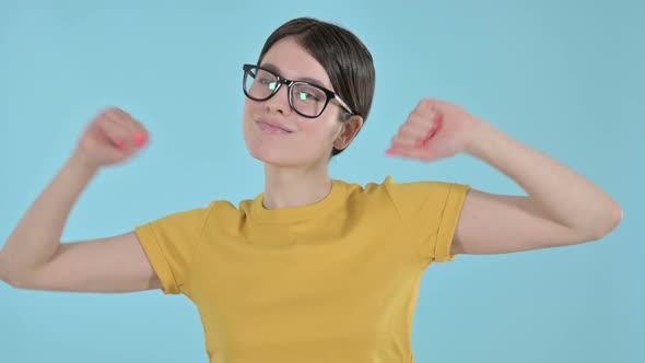 Happy Young Woman Dancing and Enjoying on Purple Background