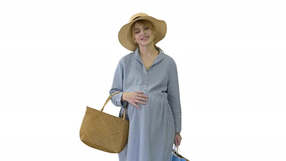 Happy Pregnant Woman in Summer Clothes Walking with Shopping Bags on White Background