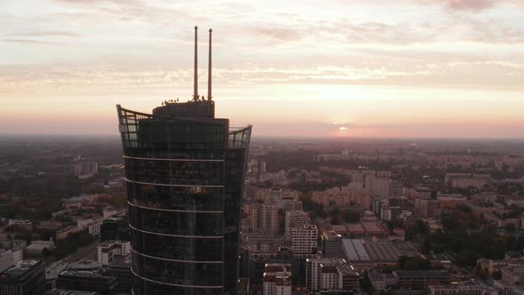 Orbit Shot Around Top of Modern Futuristic Tall Building