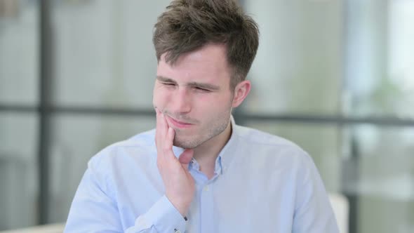 Portrait of Attractive Young Man Having Toothache Cavity