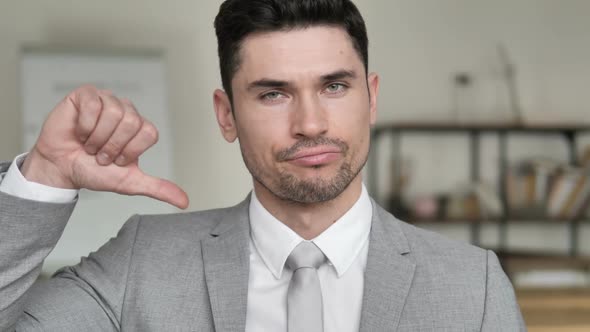 Thumbs Down By Upset Businessman