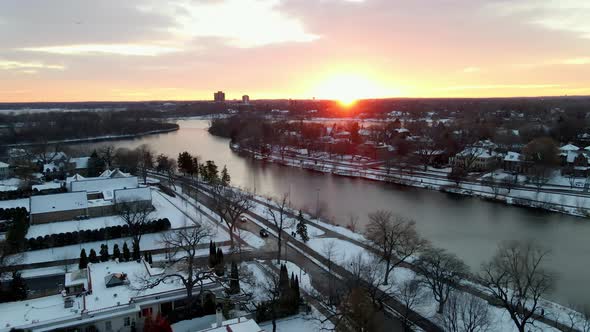 wonderful sunset over lake of the isles, minneapolis suburbs aerial view during winter