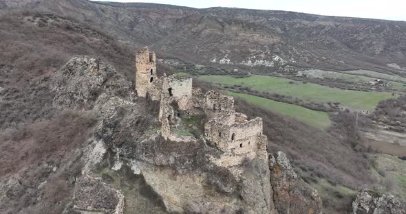 Aerial view of Drisi Castle situated on a mountain above the Tedzami River gorge. Georgia 2022