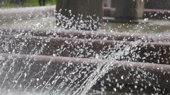 Small splashes of water from city fountain.