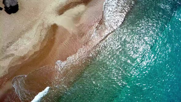 Static aerial view of the waves on the shore of a Westpunt beach, Curacao, Dutch Caribbean island