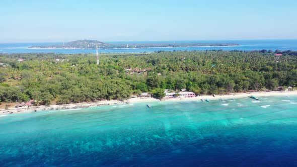 Aerial drone panorama of idyllic tourist beach time by shallow water with white sand background of a