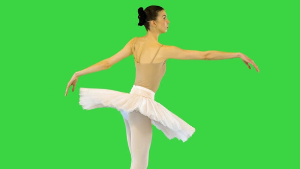 Young Ballerina Walks Demipointe Raising Arms on a Green Screen Chroma Key
