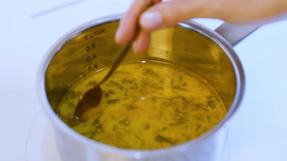 Cooking Soup On The Stove. Sauce In The Steel Pot.