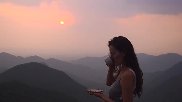 Beautiful Girl Enjoy the Organic Fresh Coffee or Masala Chai in India Hills with Top Nice View at